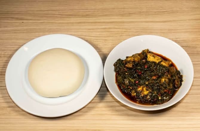 Pounded yam with efo riro vegetable soup